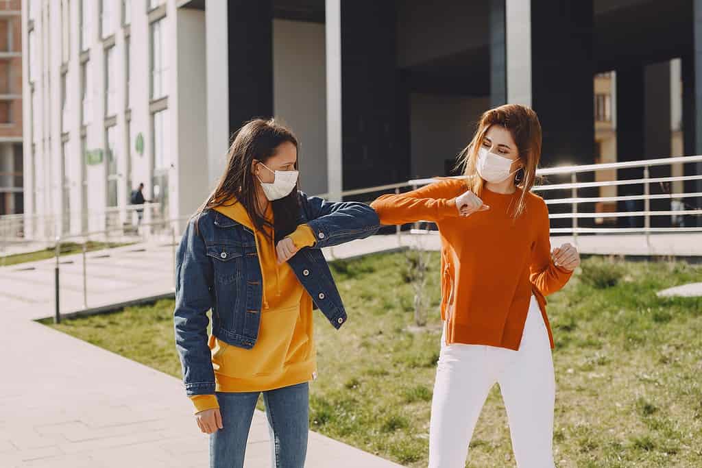 girls waving